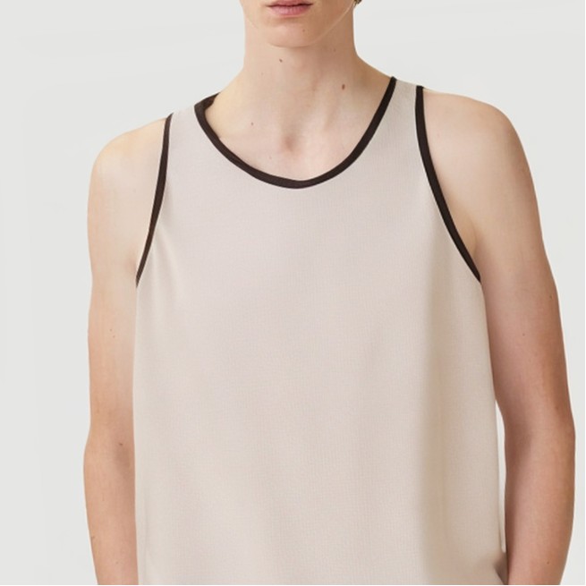 Vest with embossed print and embroidered beads